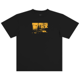 The BOSK Yellow Cab Tee is a classic fit, heavy-weight black t-shirt made from 100% cotton, featuring a bold yellow chest graphic of an urban street scene with buildings, power lines, and a car.